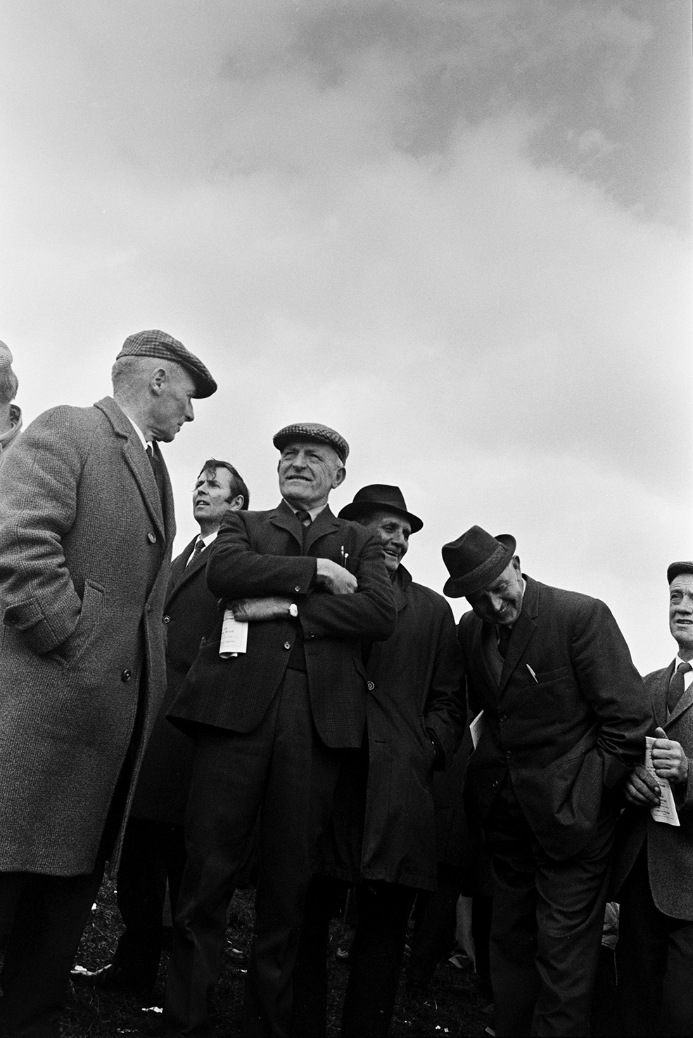 A group of men watching the Torrington Farmers Hunt Point to Point at Chapelton.