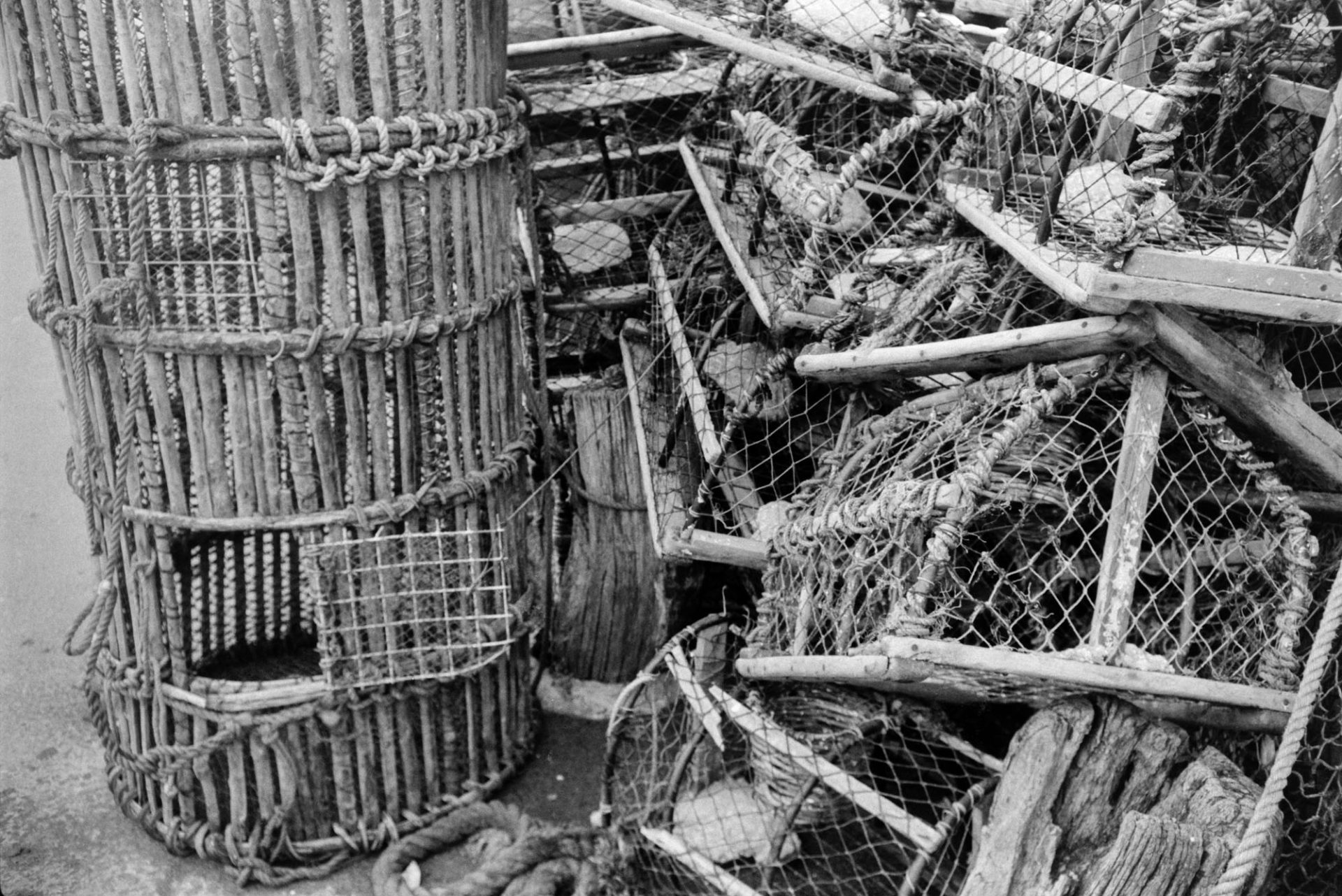 Lobster pots stacked against a wall at Ilfracombe.