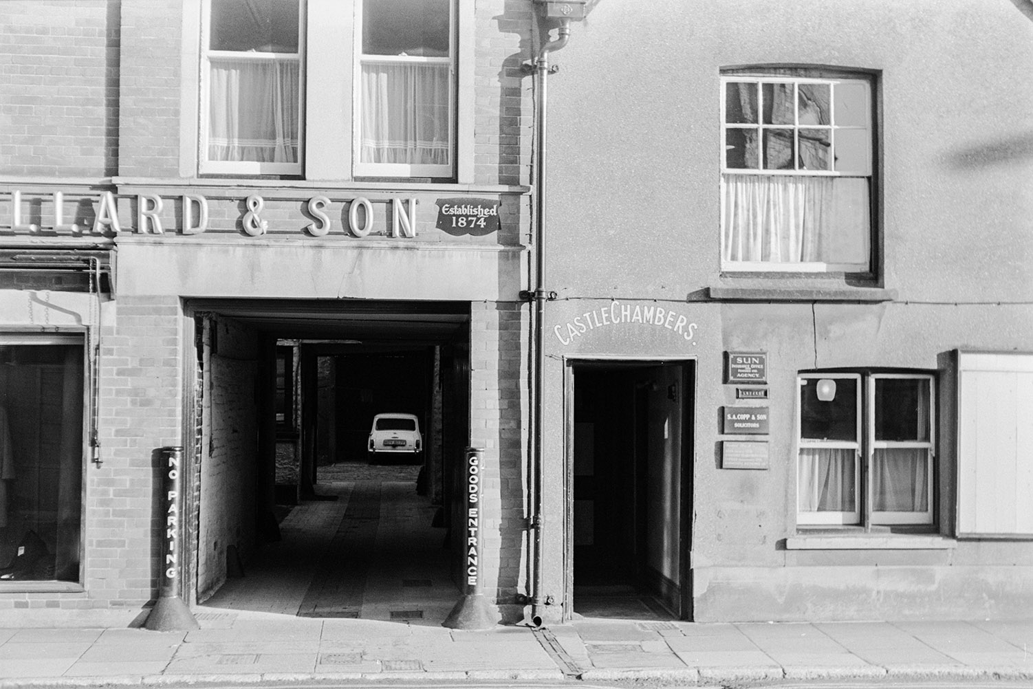 The front of Castle Chambers Solicitor office in Barnstaple. It is next to the coaching entrance of a pub. The building is now listed.