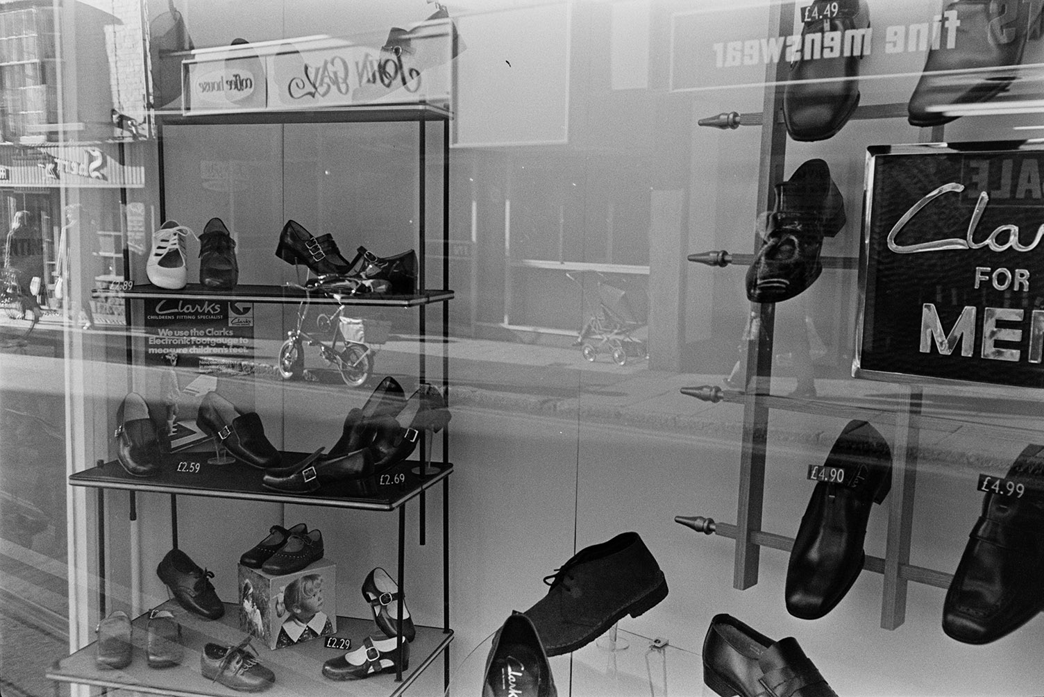 Clarks shoe shop front window display in Barnstaple. Men's, women's and children's shoes are on display.