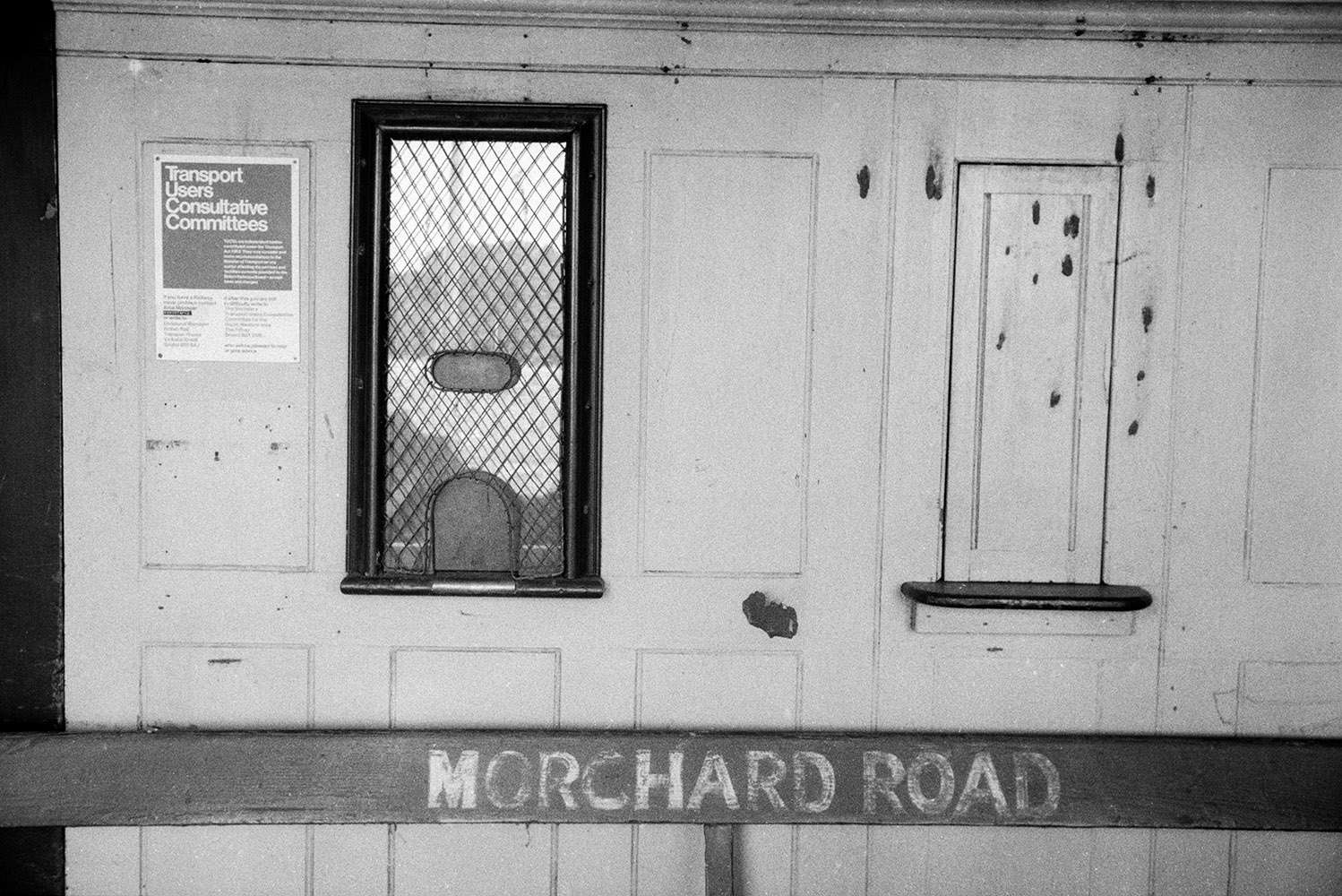 The ticket office at Morchard Road Railway Station at Down St Mary. A poster is on the wall next to the ticket office.