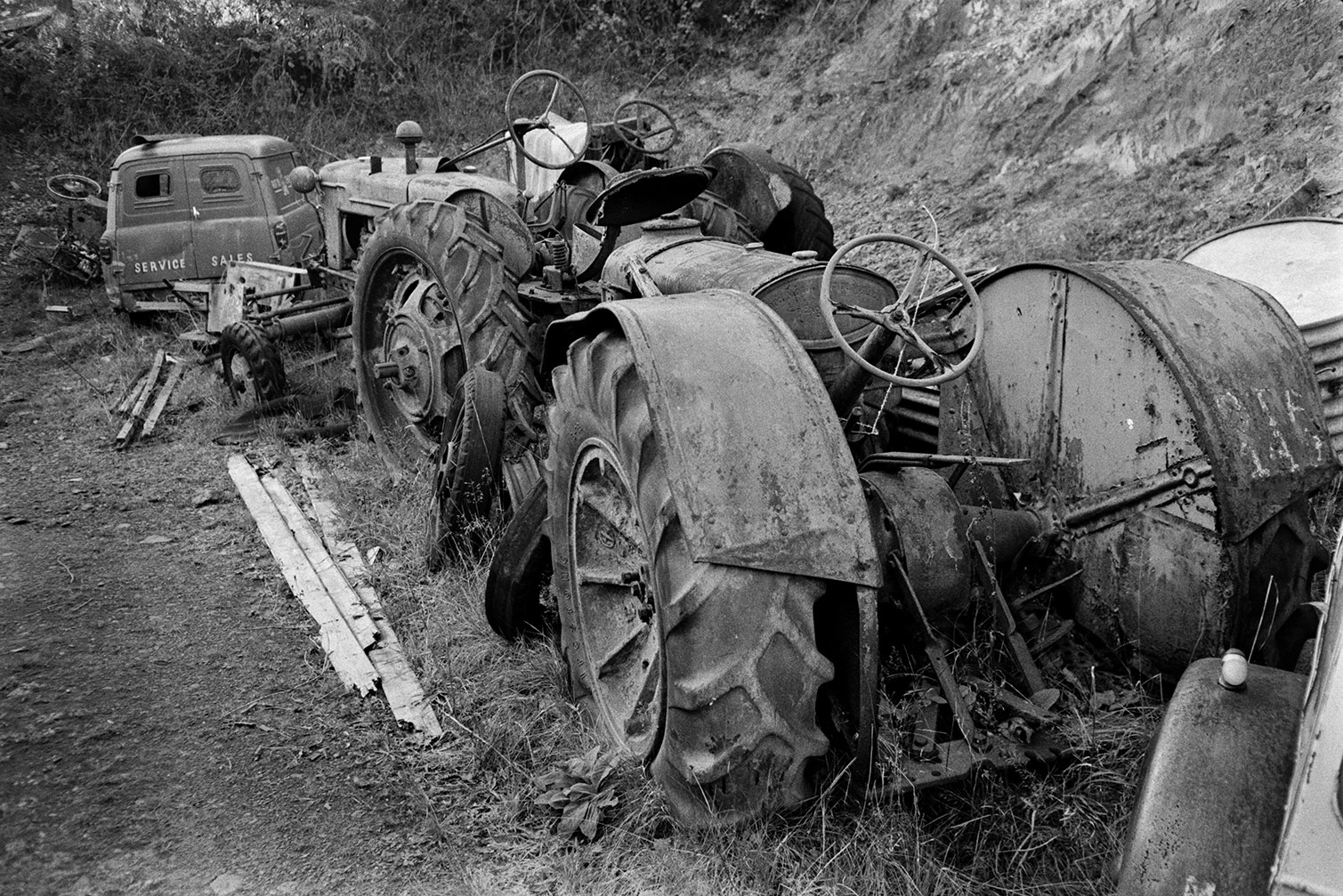 Old farm machinery, including tractors and vans, at a reclamation yard at Umberleigh.