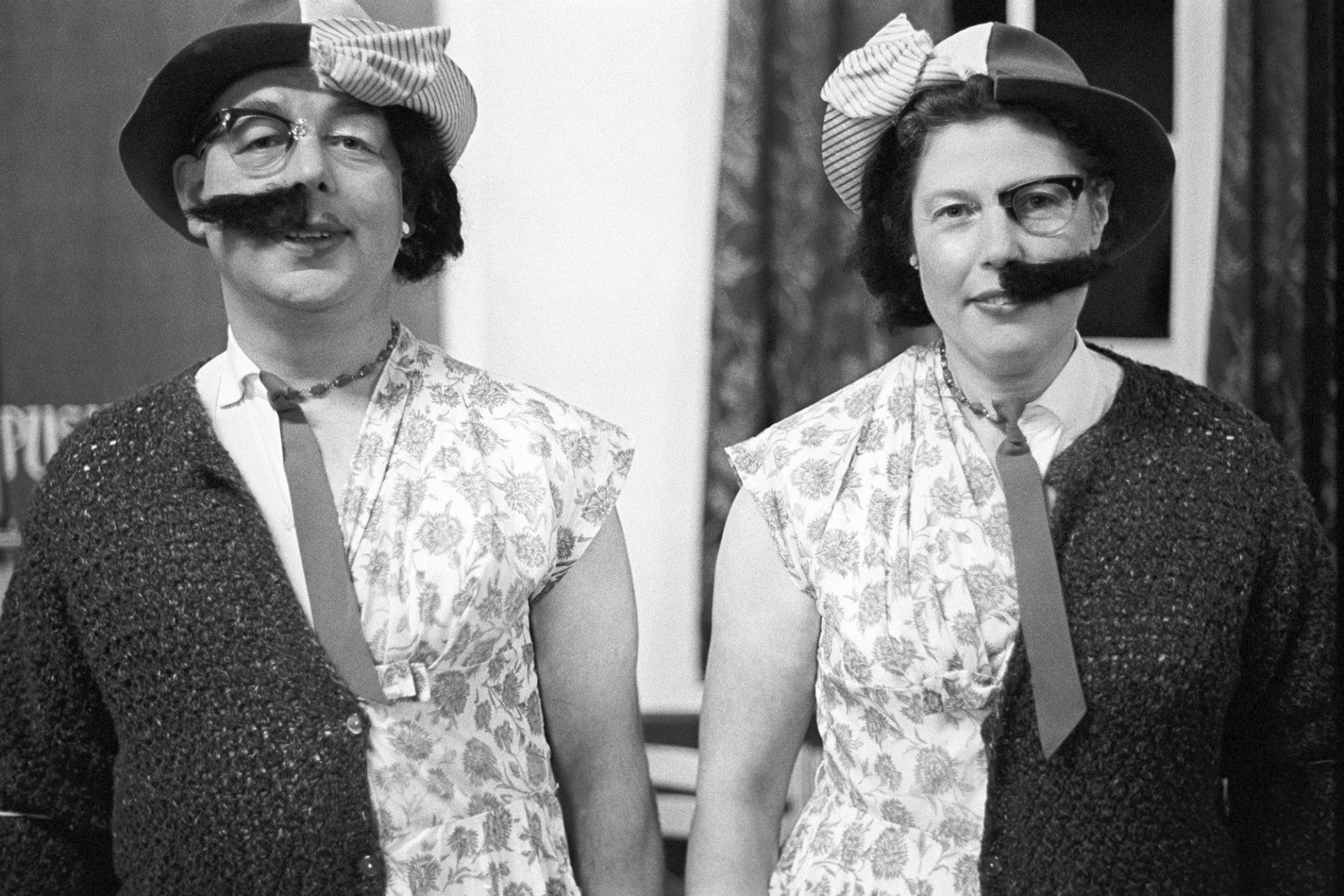 Fancy dress, couple dressed as half and half.
[Mervyn and Ethel Turner each dressed half as a man and half as a woman in Dolton Village Hall before Dolton Carnival.]