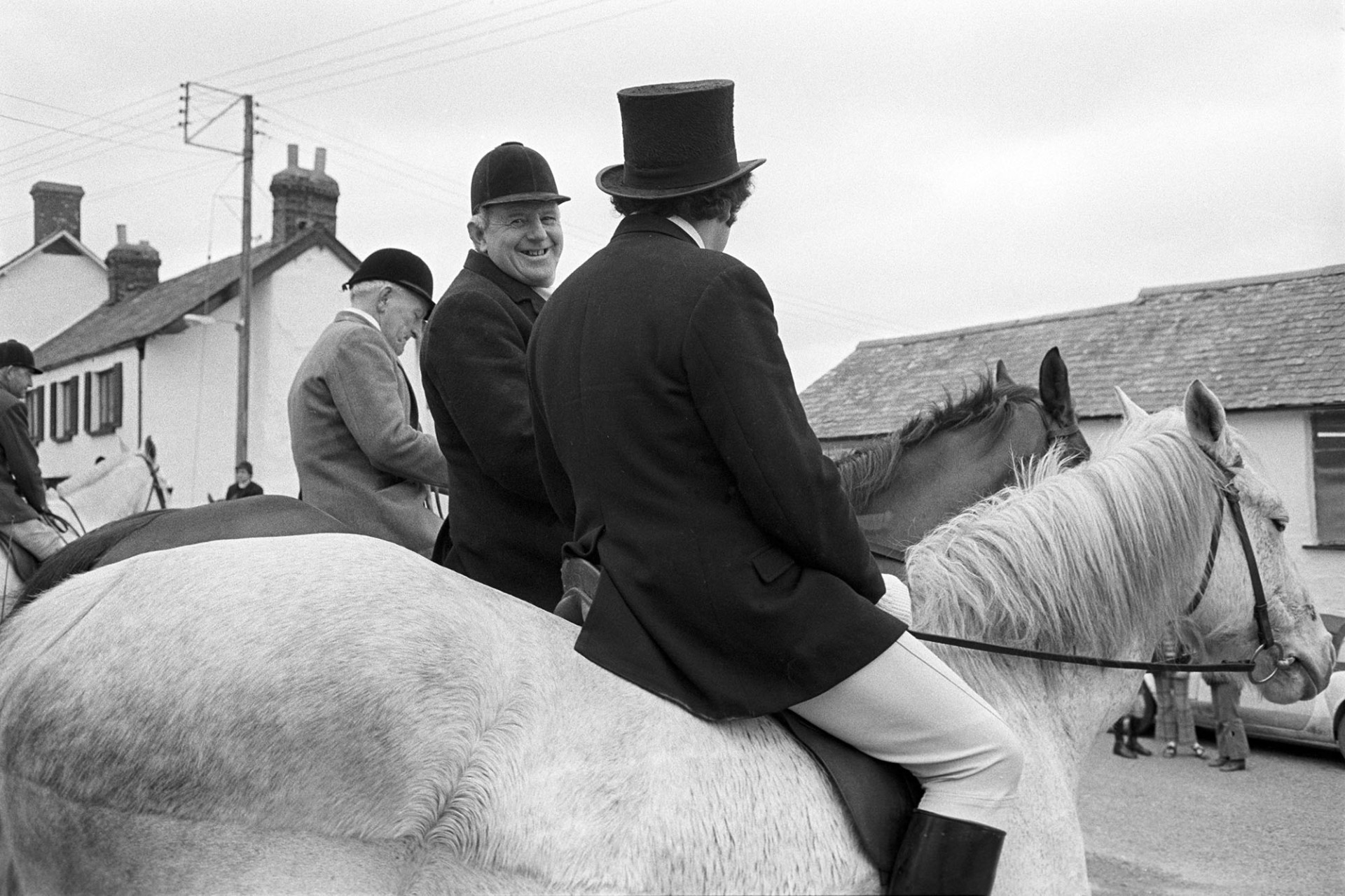 Hunt meet, Master of the Hounds Man in top hat.
[Two horse riders talking at a hunt meet at The Rams Head, Dolton. The man in the top hat is the Master of the Hunt.]