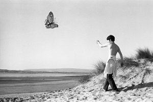 Boy flying a kite by James Ravilious