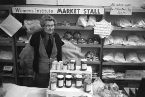 Women's Institute cake and jam stall by James Ravilious