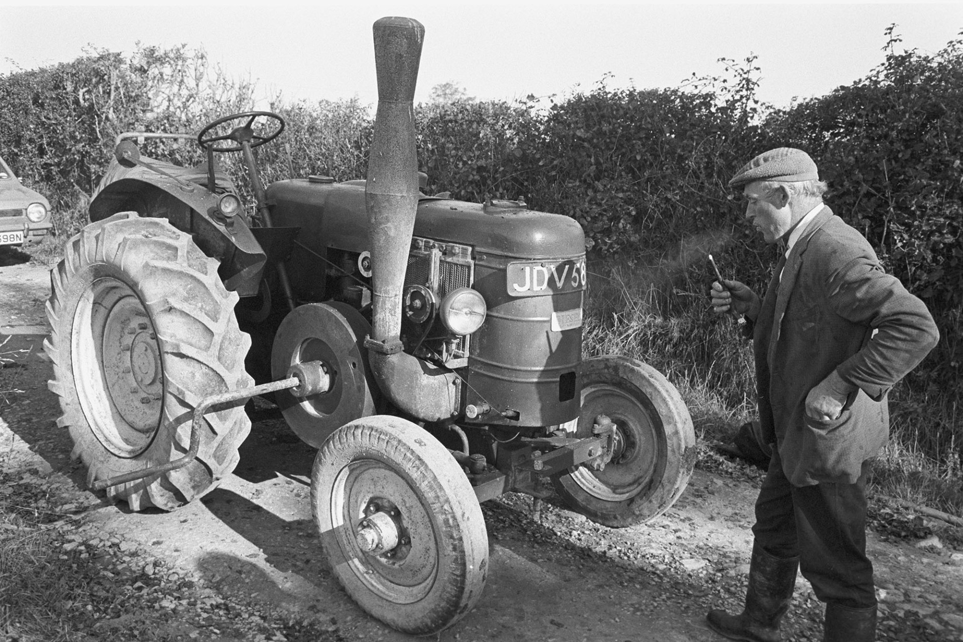 Owen Halwill with his Marshall tractor by James Ravilious