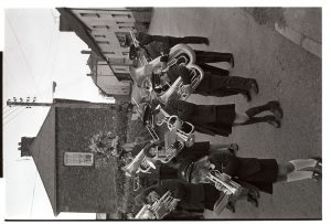 Band playing hymns in church parade by James Ravilious