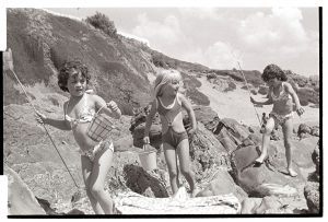 Children on the beach by James Ravilious