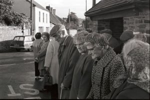 Over 60s club members waiting for the bus by James Ravilious