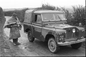 George Ayre chatting to Land Rover driver by James Ravilious