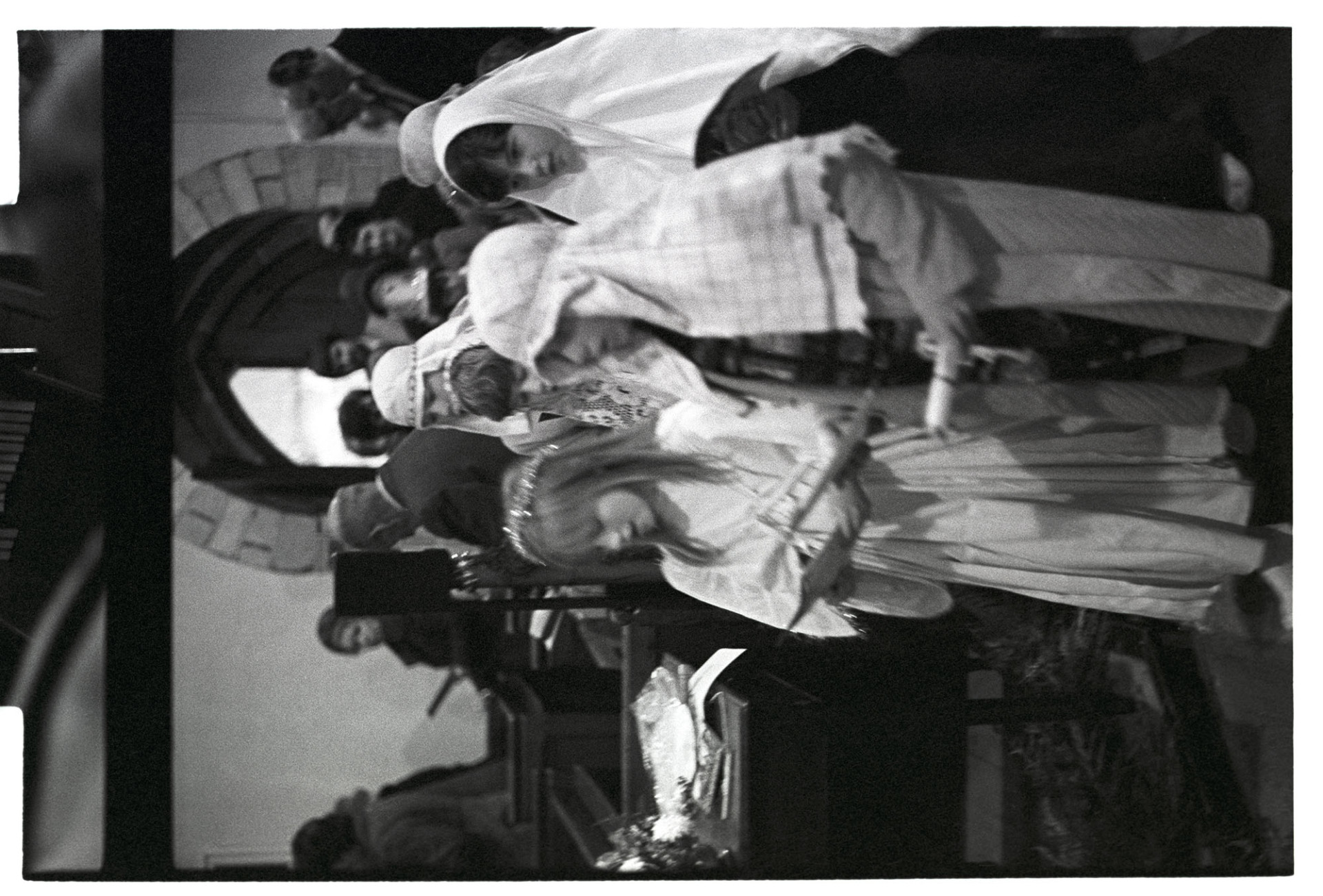 Nativity play, children in procession into church.
[Children processing into Dolton Church for a nativity play and service.  A girl is dressed as an angel and other children are dressed as shepherds. The children and congregation are singing a hymn.]