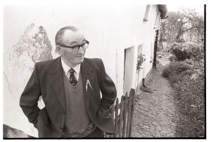 Bill Lott outside his house at the start of Club Day by James Ravilious