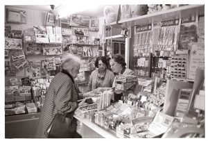 Joyce Jones and Dorothy Mutters serving a customer by James Ravilious