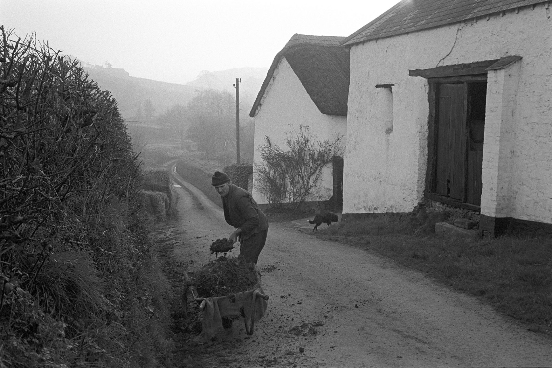 Phil Gent cleaning out a ditch by James Ravilious