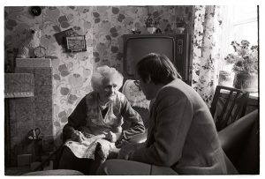 Dr Paul Bangay talking to a patient by James Ravilious