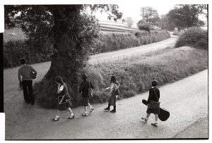 Children waiting for the school bus near Huish by James Ravilious