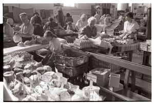 Produce stalls by James Ravilious