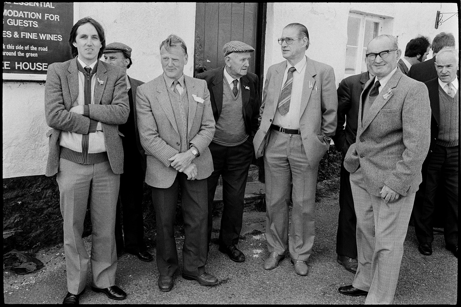 Club Day. Band and club members assembling before parade.
[A group of men standing outside the Duke of York pub in Iddesleigh on Club Day.]
