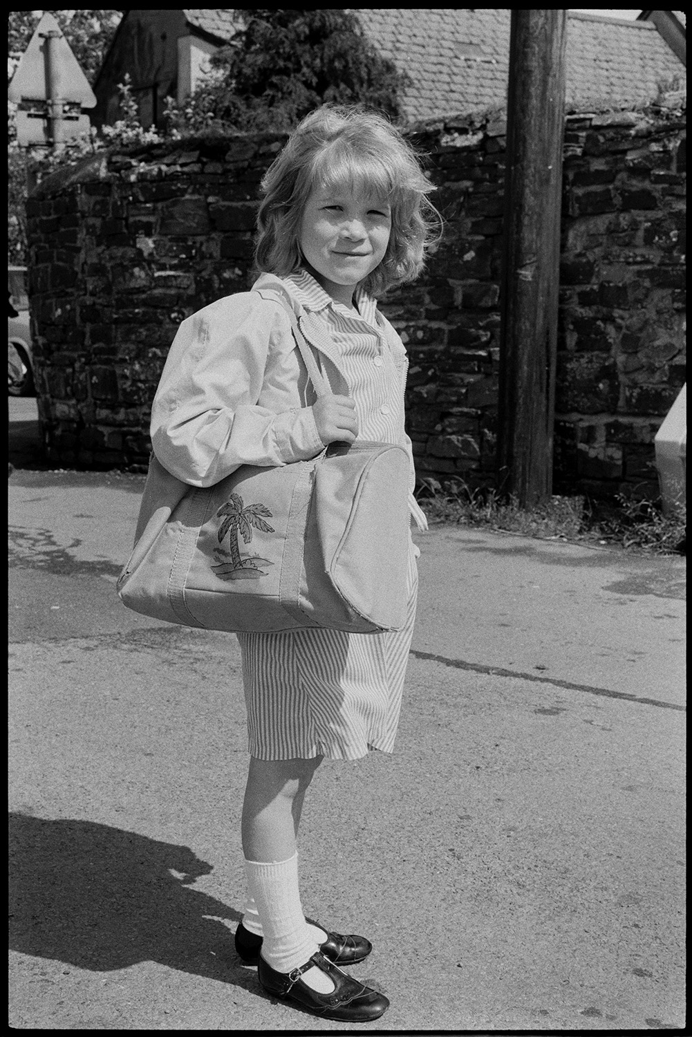 Schoolchildren after school, girls.<br />
[Nicky Squire leaving Dolton Primary School, carrying a holdall bag.]