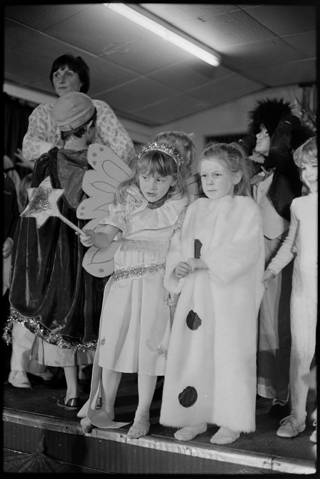 Christmas show in village hall Nativity play, children performing.
[Children performing in a Christmas show on the stage of Dolton Village Hall. One child is dressed as a fairy.]