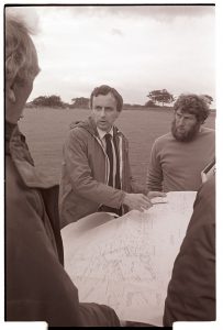 Site-meeting to discuss plans for the new school by James Ravilious