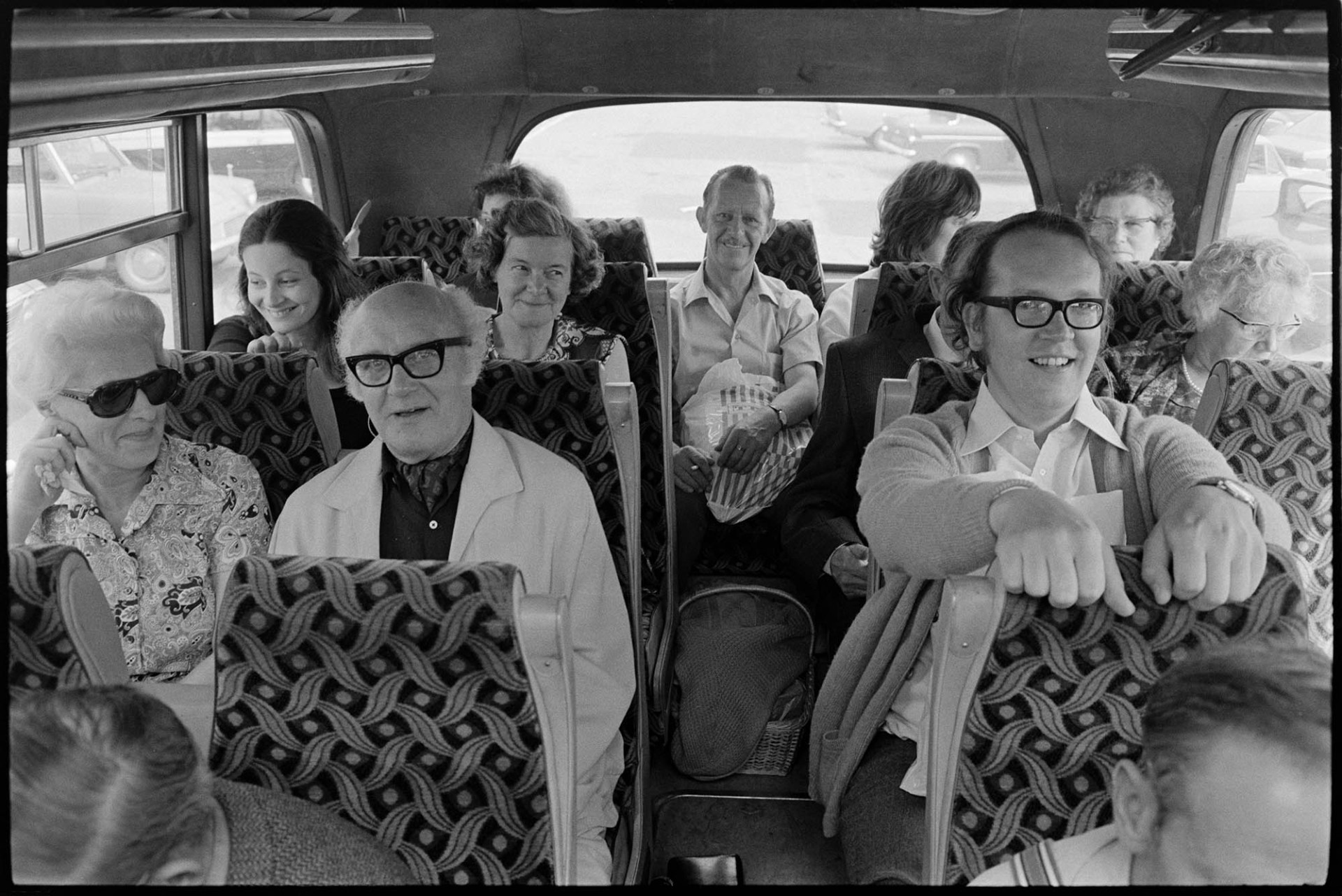 Passengers on Friday bus to Barnstaple. Driver John Beer from Chulmleigh.<br />
[Men and women sat at the back of the bus including Robin Ravilious, at the back on the left and Richard Davin, on the right at the front, who managed the wardrobe of the Orchard Theatre for many years.]