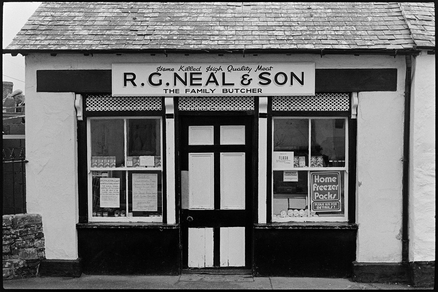 Front of butchers shop before renovation. 
[The front of R G Neal & Son butcher's shop in Dolton before it was refurbished.]