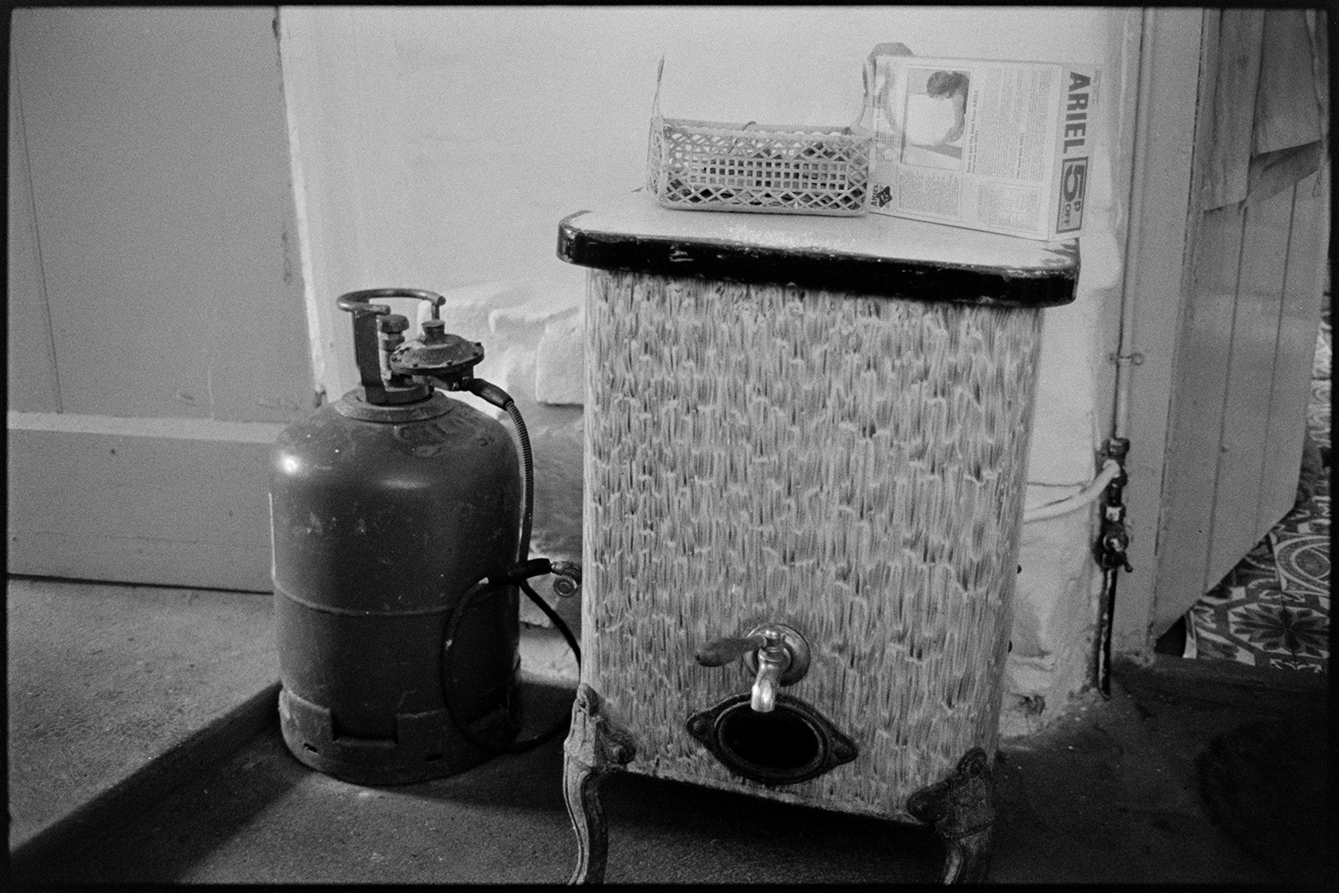 Gas boiler for water with cylinder. 
[A gas cylinder and gas boiler for hot water in a house, possibly Emily Easterbrook's home, in West Lane, Dolton.]