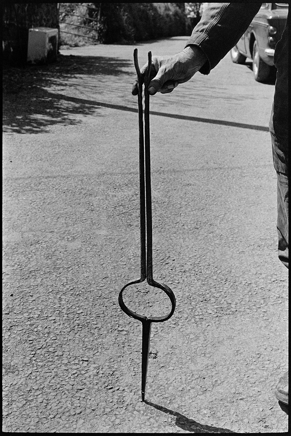Rod stripper. 
[A metal rod used for stripping willow. It is being held by either Bill Cooke or Bill Folland at Colehouse, Riddlecombe.]