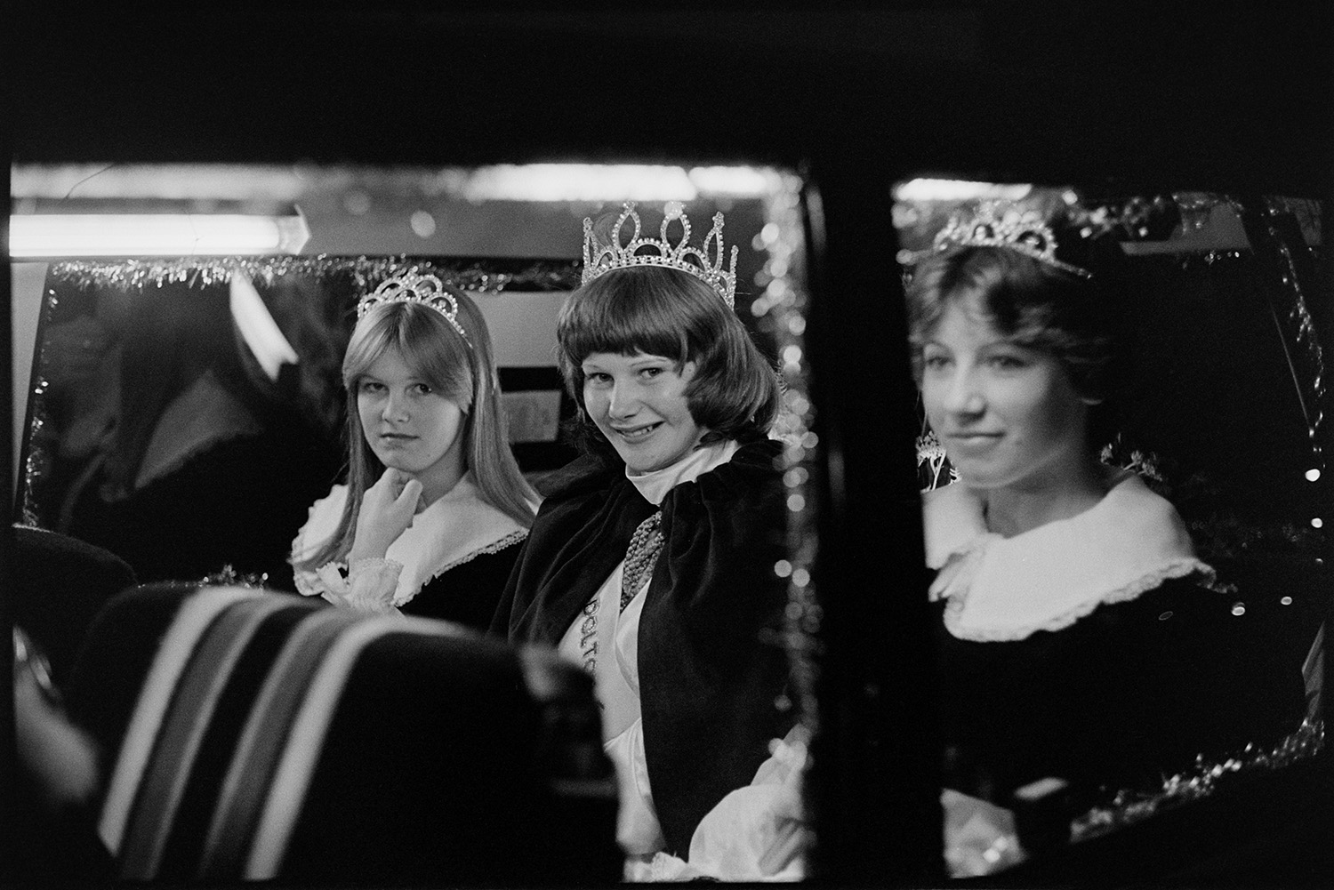 Carnival Queen in car with attendants. 
[A Carnival Queen with her attendants in a car at Hatherleigh Carnival.]